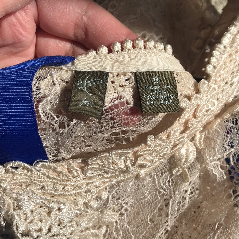 Fei cream lace top.  Blue detail.